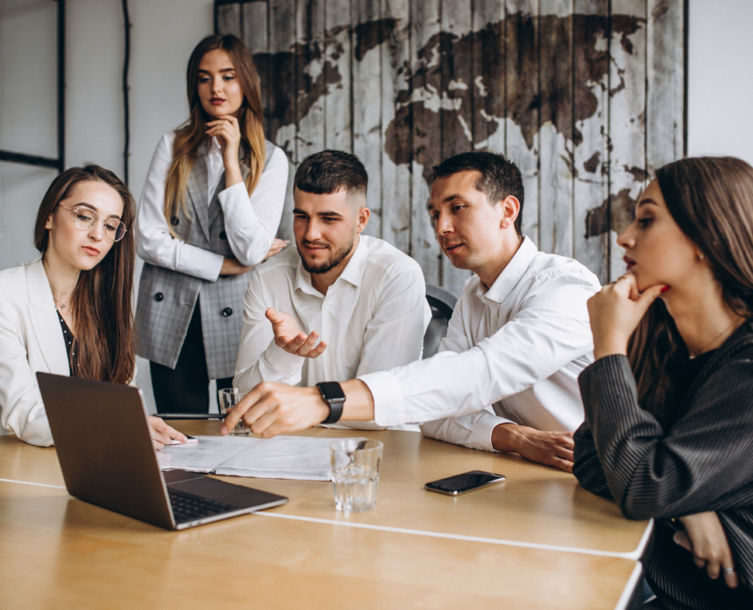 Group of people working out business plan in an office